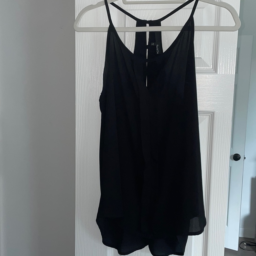 Black tank with keyhole and button detail on back.